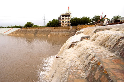 Water is accumulated during rain season in large surface water dam Om Ashram Rajasthan, India